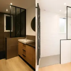 Salle de bain sombre avec douche à l'italienne, lavabo et meuble en bois. Le contraste entre les carreaux sombres et le blanc crée une ambiance moderne.