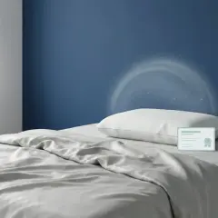 Un oreiller mémoire de forme, symbole de confort, peut présenter un danger s'il n'est pas bien aéré. Icônes de certification et de ventilation.